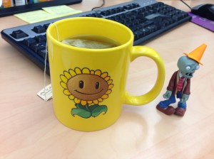 Hot tea in my Plants vs. Zombies sunflower mug